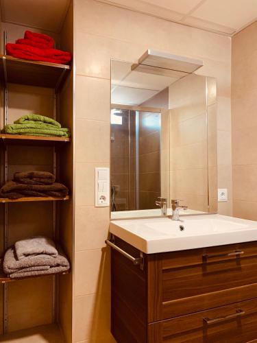 a bathroom with a sink and a mirror at Casa del Herrero in Chulilla