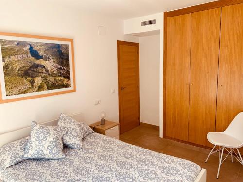 A bed or beds in a room at Casa del Herrero