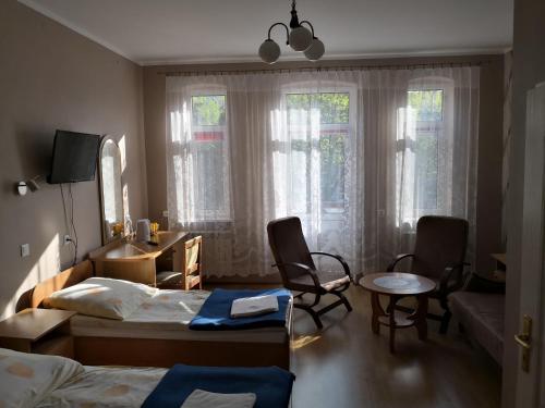 Tempat tidur dalam kamar di Ośrodek Wypoczynkowy Janówka
