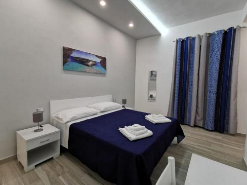 Katil atau katil-katil dalam bilik di B&B La Casa di Pino