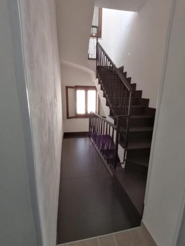 a view of a staircase in a building with a window at B&B La Casa di Pino in Lampedusa