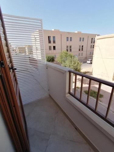 a balcony with a view of a building at B&B La Casa di Pino in Lampedusa