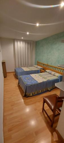Katil atau katil-katil dalam bilik di Hostal del campo