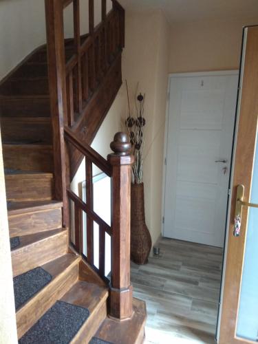 a staircase in a home with wooden floors at Ubytování s vyhlídkou in Český Krumlov