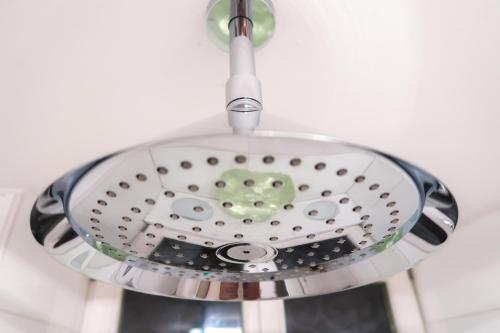 a glass ceiling light with a heart on it at Rose Garden Retreat Private Terrace Baden-Baden in Baden-Baden