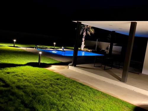 a night view of a swimming pool at night at Villa Eni Medulin Sisan heated pool in Šišan