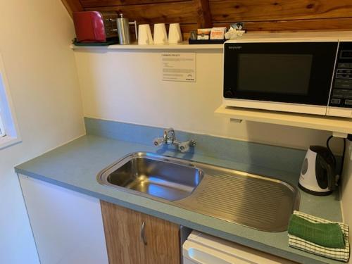 Cucina o angolo cottura di Mountain Chalets Motel