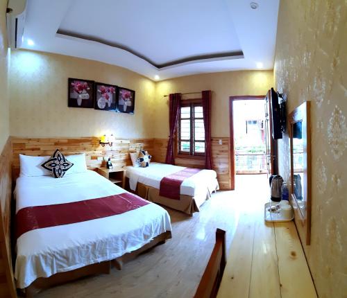 Ένα ή περισσότερα κρεβάτια σε δωμάτιο στο Dang Khoa Garden Inn
