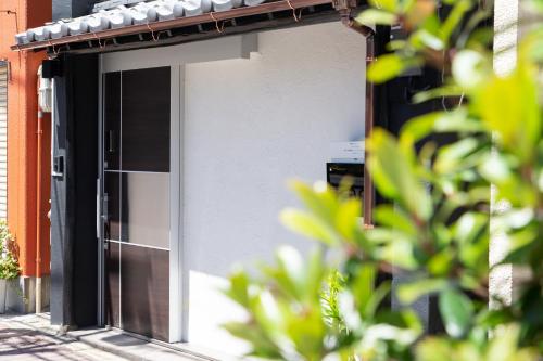 a building with an open door on the side of it at My Home in Tokyo in Tokyo