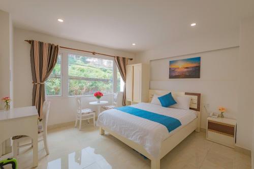 Ліжко або ліжка в номері Thanh Thanh Hotel