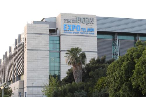 a building with a sign on the side of it at Rosen Villa at Ramat Hahayal in Tel Aviv