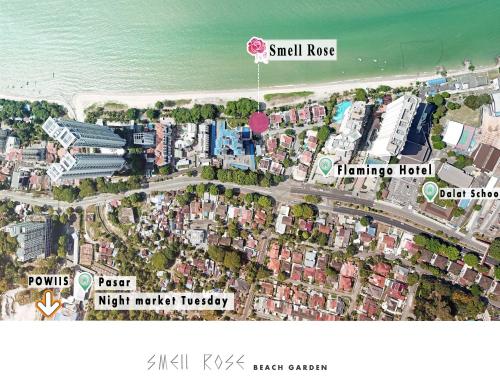 un mapa de una ciudad con edificios y el océano en Smell rose beach garden en Batu Ferringhi