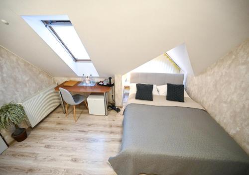 Posteľ alebo postele v izbe v ubytovaní Penzion Pri Parku