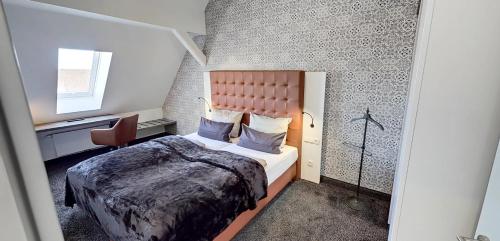 Postel nebo postele na pokoji v ubytování Boardinghouse Emden