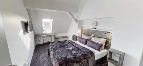 Postel nebo postele na pokoji v ubytování Boardinghouse Emden