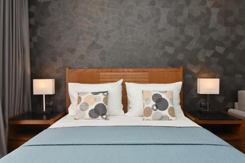 Postel nebo postele na pokoji v ubytování Hotel Perla
