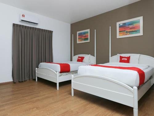 Tempat tidur dalam kamar di OYO 89915 East Mount Hotel