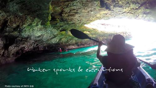 a person riding a kayak in a river in a cave at B&B Villa Giuliana in Arnesano
