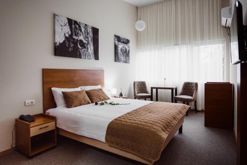 Giường trong phòng chung tại Sajam Garni hotel