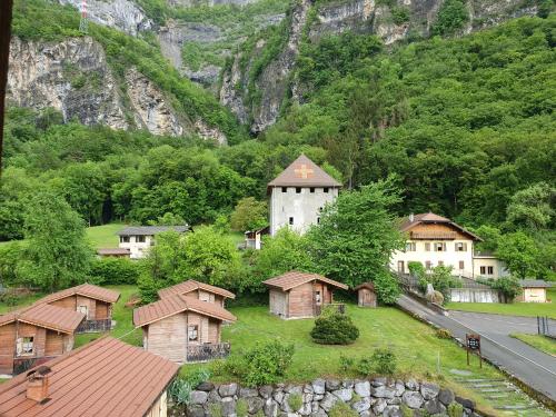 a group of houses and a building with a mountain at Le Relais Du Mont Blanc in Magland