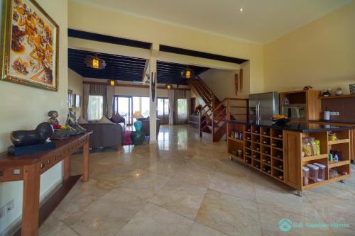 a large living room with a couch and a table at Villa Lumba Lumba - When perfection isn't enough! in Bubunan