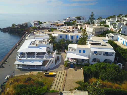 an aerial view of a group of houses and the water at Hotel Lisca Bianca in Panarea