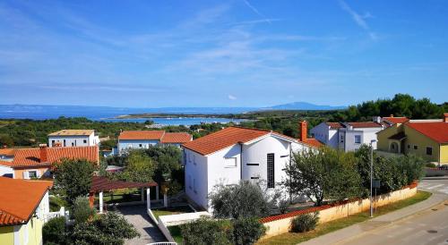 a small town with houses and a road at Studio Apartment Lela Ližnjan in Ližnjan