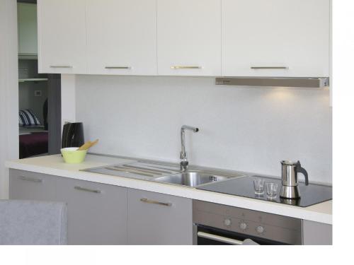 Kuchyň nebo kuchyňský kout v ubytování Appartamento Mandorla - Theater Home