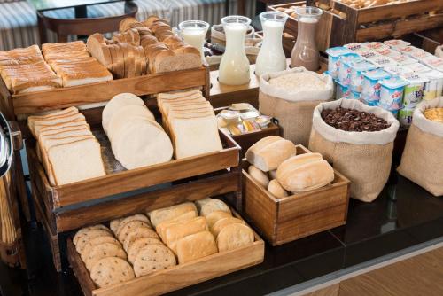a display of bread and pastries on a table at Holiday Inn Express - Antofagasta by IHG in Antofagasta