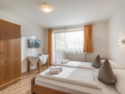 Säng eller sängar i ett rum på Ferienhaus Bergwelt