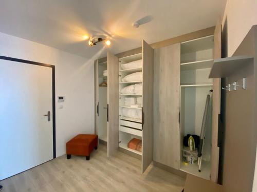 a room with a walk in closet with glass doors at Seven days Smíchov in Prague