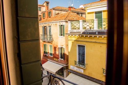 a view of a city from a window at Apostoli in Venice