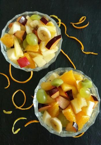 two plastic cups filled with fruit and vegetables on a table at KRISKO parking privé et clos in Armentières