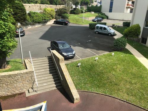 a car is parked in a parking lot at Carpe Diem in Le Val-André