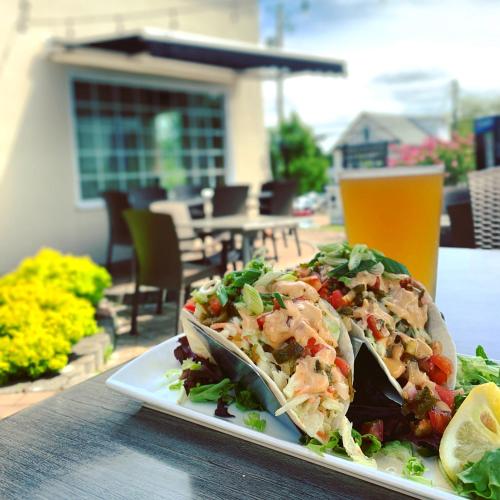 a plate of food with a salad on a table at Inn on Prince Hotel and Conference Centre Truro in Truro
