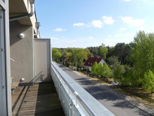 a balcony with a view of a street at DünenResort in Binz, strandnahe und moderne FeWos mit Balkon, teilweise mit Meerblick, in Binz