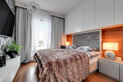 Posteľ alebo postele v izbe v ubytovaní Apartament AGA Motława Starówka
