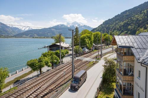 a truck parked on the tracks at a train station at Hotel Seehof in Zell am See