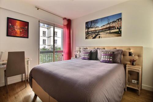 Кровать или кровати в номере Assia & Nathalie - Luxury B&B MARAIS