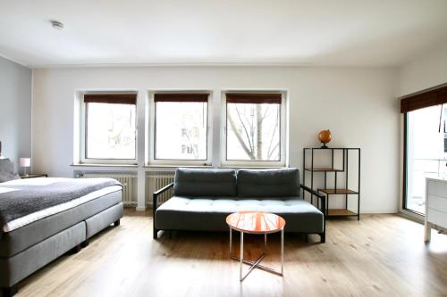 Ένα ή περισσότερα κρεβάτια σε δωμάτιο στο Arthouse Apartments im Pantaleonsviertel
