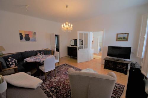 a living room with a couch and a table at Stieglerhof KG in Illmitz