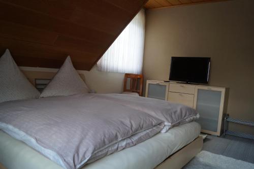 Katil atau katil-katil dalam bilik di Ferienwohnung Unter dem Schild