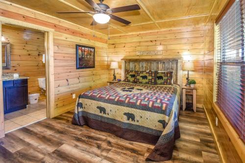 a bedroom with a bed and a ceiling fan at SmokyStays 10 Bedroom Cabin in Pigeon Forge