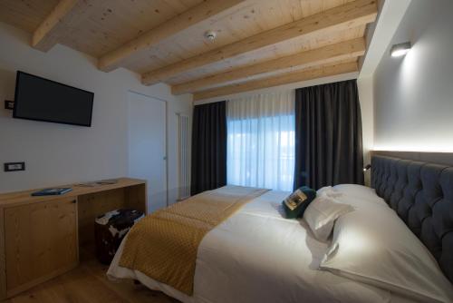 Кровать или кровати в номере Hotel La Meridiana