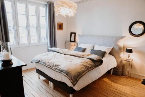 Ένα ή περισσότερα κρεβάτια σε δωμάτιο στο Les Apparts d 'Agnès - Carmen