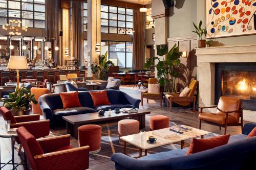 a living room filled with furniture and a fire place at The Hoxton, Chicago in Chicago