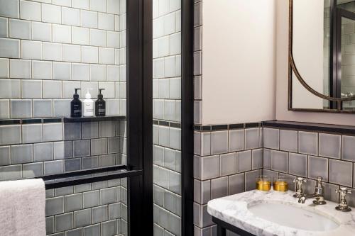a bathroom with a sink and a mirror at The Hoxton, Chicago in Chicago