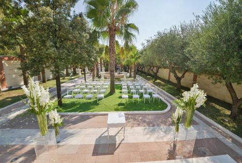 an overhead view of a wedding venue with chairs and trees at Mediteran Hotel & Resort in Budva