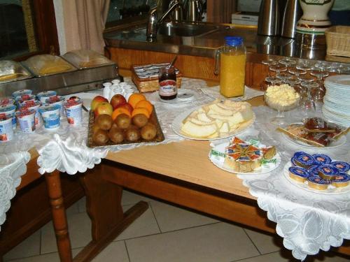a table with a bunch of food on it at Landgasthaus Kreuz beim Tom in Rastatt