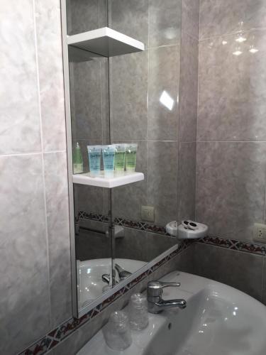 a bathroom with a sink and a mirror at Villa De Foz in Foz